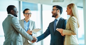 Two business men shaking hands on a meeting